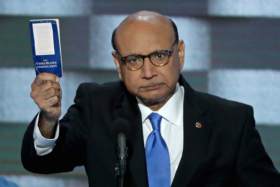 Khizr Khan, father of deceased Muslim US soldier, holds up a booklet of the US Constitution as he delivers remarks on the fourth day of the Democratic National Convention in Philadelphia.