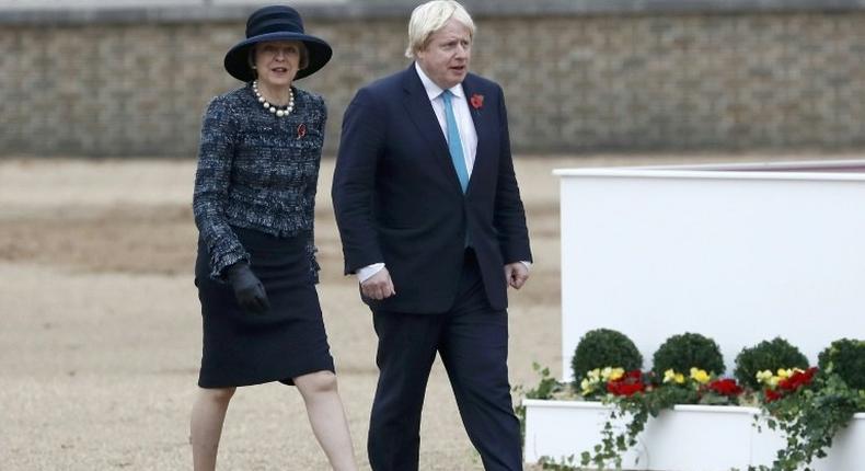 Britain's Prime Minister Theresa May (L) and British Foreign Secretary Boris Johnson arrive to take part in a ceremonial welcome at Horse Guards Parade