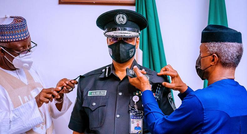 Vice President Osinbajo decorates new acting IGP Usman Baba at the State House Abuja on Wednesday April 7, 2021 (Tolani Alli)