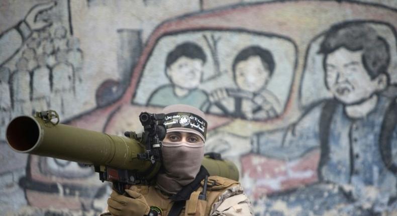 A member of Hamas's military wing takes part in a rally in Gaza City on December 14, 2016, marking the movement's 29th anniversary