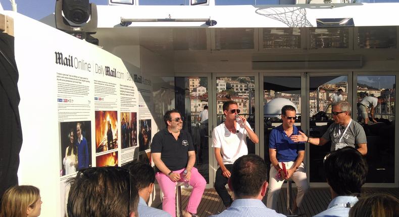 Snap CEO Evan Spiegel (white shirt) at an event in Cannes, France.