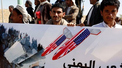 People protest airstrikes by the Saudi-led coalition against a prison in Saadah Province, a Houthi stronghold in Yemen, January 22, 2022