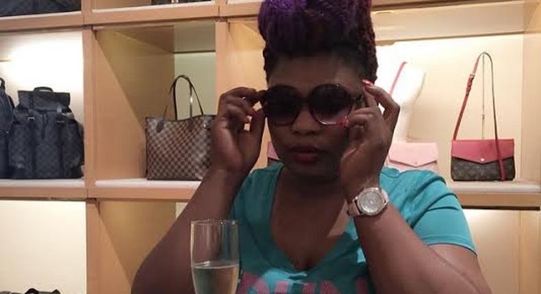 Laide Bakare try on an eye wear at Louis Vouitton store while sipping on an expensive champagne as a customer