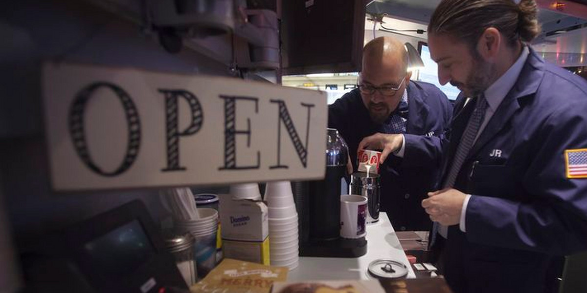 Traders make cappuccino in their booth on the floor of the NYSE in New York