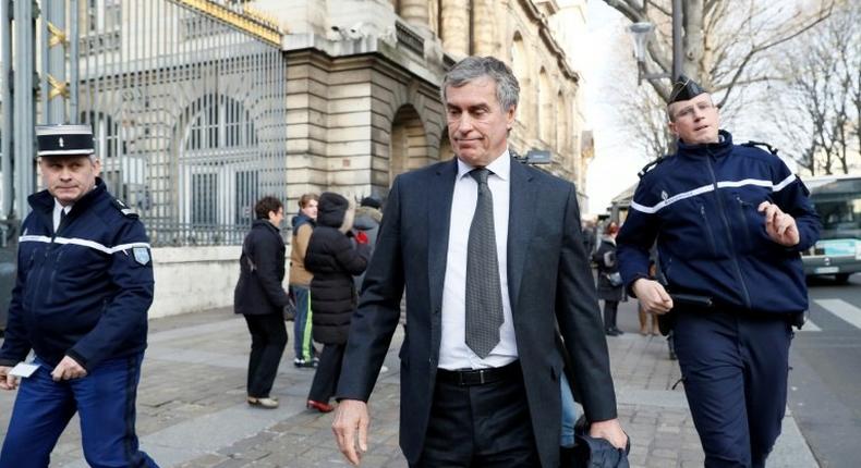 Former French budget minister Jerome Cahuzac (centre) leaves the Paris courthouse following his tax fraud trial on December 8, 2016