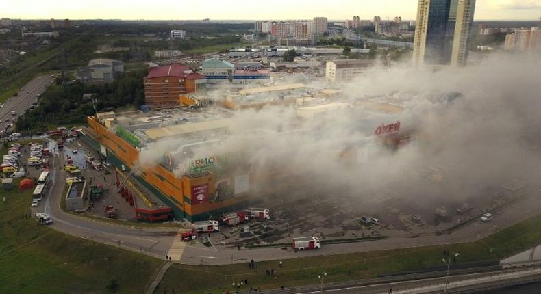 Smoke engulfed the Rio shopping mall in Moscow during a fire that sent 14 people to hospital