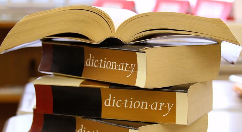 A stack of dictionaries.