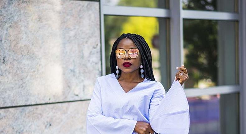 Titilola Sogunro does a chic detailed shirt over denim