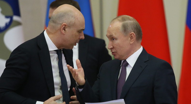 Anton Siluanov (left) is finance minister in the government of Russian President Vladimir Putin (right).