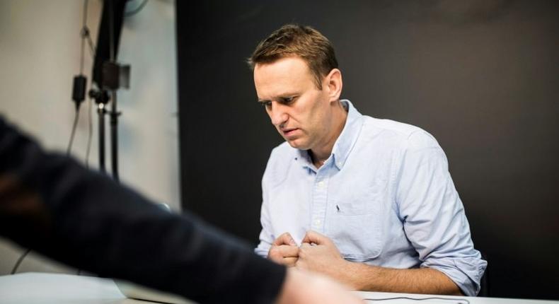 This handout photograph released by 'This Is Navalny Project' shows Russian opposition leader Alexei Navalny in his office in Moscow on July 7, 2017