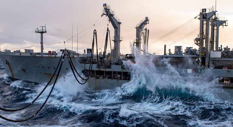 Fleet replenishment oiler USNS Leroy Grumman alongside the amphibious assault ship USS Iwo Jima in the Norwegian Sea, October 27, 2018.