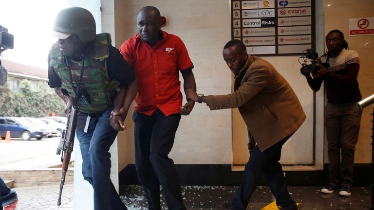 A Flying Squad operative helps civilians during the January 15 attack at Dusit Complex. Al Shabbab operative Fawaz Ahmed Hamdun suspect in Dusit D2 attack arrested