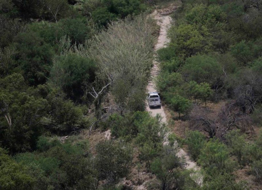 A Customs and Border Protection vehicle patrols along the US-Mexico border near Mission, Texas, July 24, 2014.