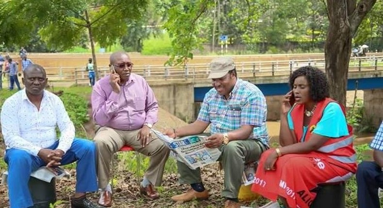 Kabete MP Ferdinand Waititu (reading newspaper), Thika Town MP Alice Nganga (right).