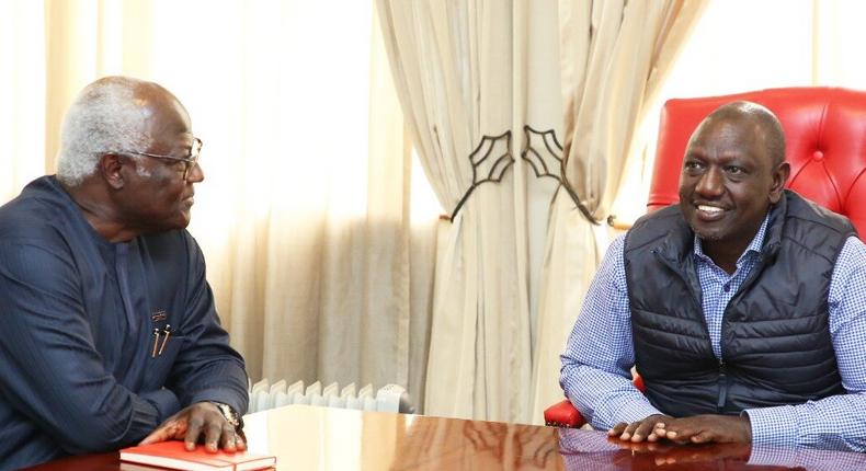 Deputy President William Ruto (right) interacts with Ernest Bai Koroma, former President of Sierra Leone, at the Karen Office where he held a meeting with the AU-COMESA Election Observer Mission 