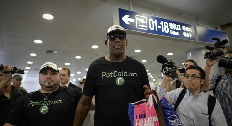 Former NBA player Dennis Rodman arrives to check-in for his flight to North Korea, at Beijing's international airport, on June 13, 2017