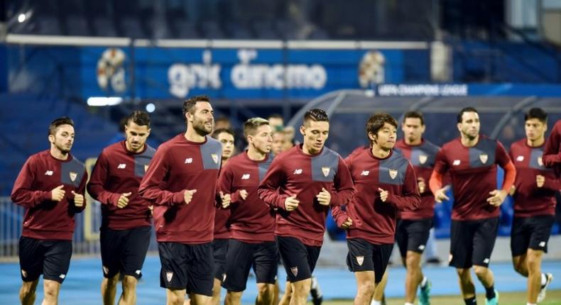 Sevilla's players run during a training session at the Maksimir stadium in Zagreb, on October 17, 2016