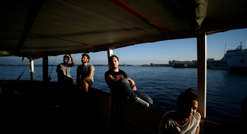 It would be desirable if... an agreement is reached so that seven or eight countries coordinate to distribute the people, said Proactiva Open Arms founder Oscar Camps. Crew members are shown aboard the ship on World Refugee Day in June