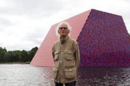 Artist Christo stands in front of his work The London Mastaba, on the Serpentine in Hyde Park, Londo