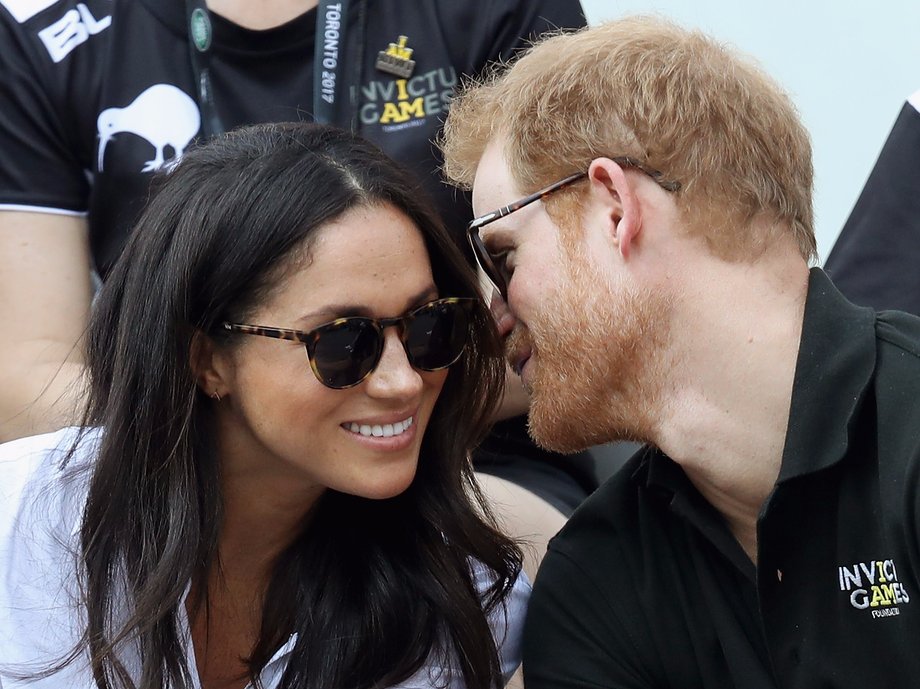 Prince Harry (R) and Meghan Markle (L) attend a Wheelchair Tennis match during the Invictus Games 2017 at Nathan Philips Square on September 25, 2017 in Toronto, Canada