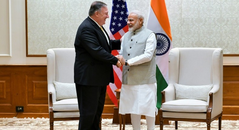 US Secretary of State Mike Pompeo shakes hands with Indian Prime Minister Narendra Modi during their meeting