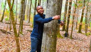 Ghanaian environmentalist sets new Guinness World Record by hugging 1,123 trees in one hour