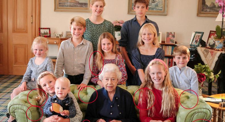 A family portrait of Britain's late Queen Elizabeth II with some of her grandchildren and great-grandchildren, with indications by Reuters of areas that appear to have been digitally altered by the source.THE PRINCE AND PRINCESS OF WALES/KENSINGTON PALACE/Handout via REUTERS
