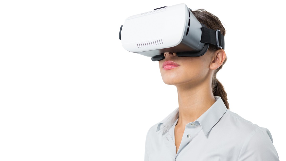 Female executive using virtual reality headset