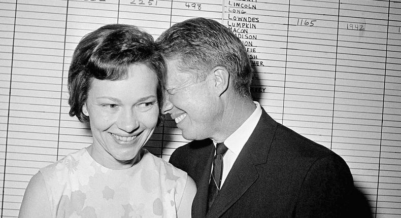 In a photograph from September 1966, then Georgia State Sen. Jimmy Carter hugs his wife, Rosalynn, at his Atlanta campaign headquarters.Horace Cort/Associated Press