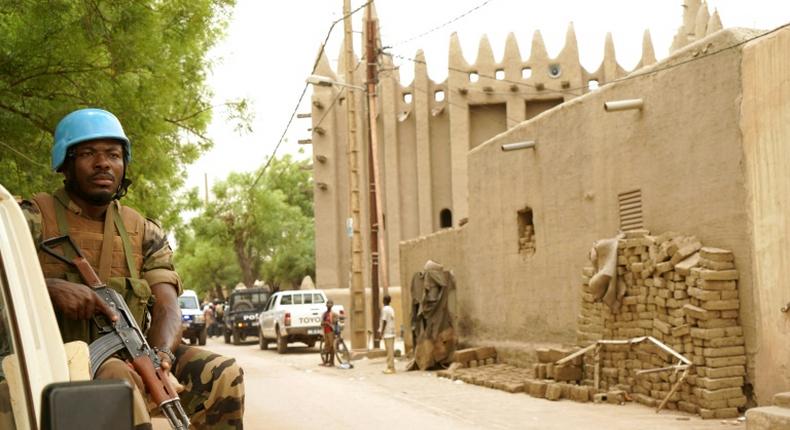 A UN peacekeeper patrols outside the mosque in Mopti, central Mali -- UN Secretary General Antonio Guterres has called for the force's mandate to be renewed for another year, without any cuts to personnel