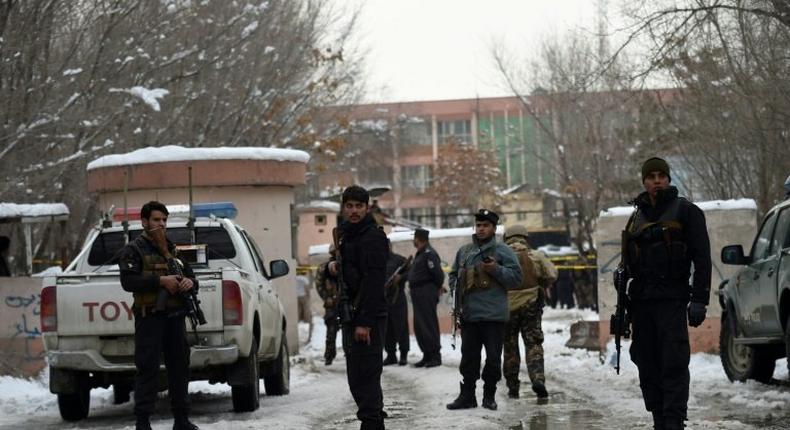 Afghan security personnel stand guard at the site of a suicide blast near the Afghan Supreme Court in Kabul on February 7, 2017