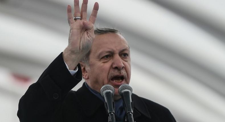 Turkish President Recep Tayyip Erdogan gestures as he delivers a speech on December 20, 2016 in Istanbul