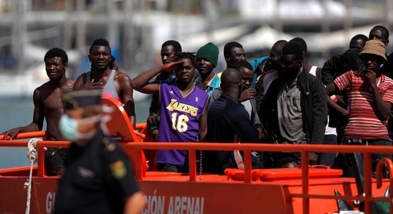 Migrants, who are part of a group intercepted aboard a dinghy off the coast of the Mediterranean sea, stand on a rescue boat upon arriving at a port in Malaga, southern Spain, September 6, 2016. 