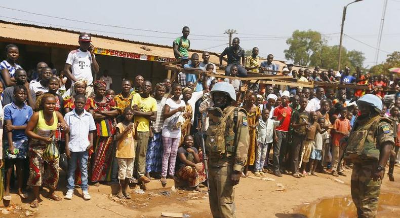 United Nations peacekeepers from Gabon stand alongside a road before the Pope Francis' arrival at the refugee camp of Saint Sauveur, in the capital Bangui, November 29, 2015. REUTERS/Stefano Rellandini