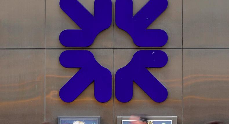 A woman uses an ATM at a Royal Bank of Scotland (RBS) branch in London, Britain, February 25, 2010.