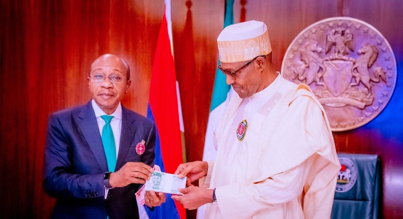 The redesigned notes launched in December 2022 with the backing of CBN governor, Godwin Emefiele (left), and President Muhammadu Buhari (right) [Presidency]