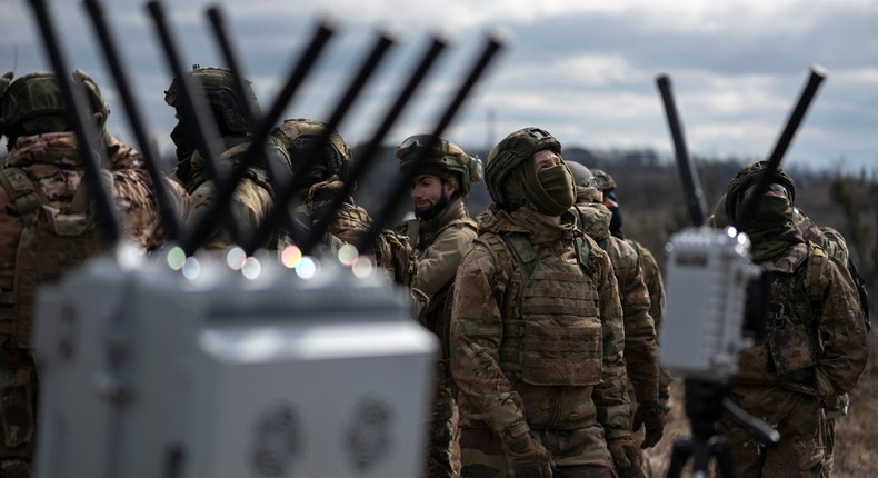 Ukrainian soldiers stand near a portable device designed to counter FPV drones during a presentation on March 19, 2024 in Ukraine.Photo by Viktor Fridshon/Global Images Ukraine via Getty Images