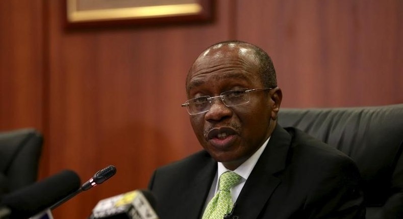 Godwin Emefiele, Governor of Nigeria's Central Bank addressing pressmen at the end of a monetary policy committee meeting in Abuja