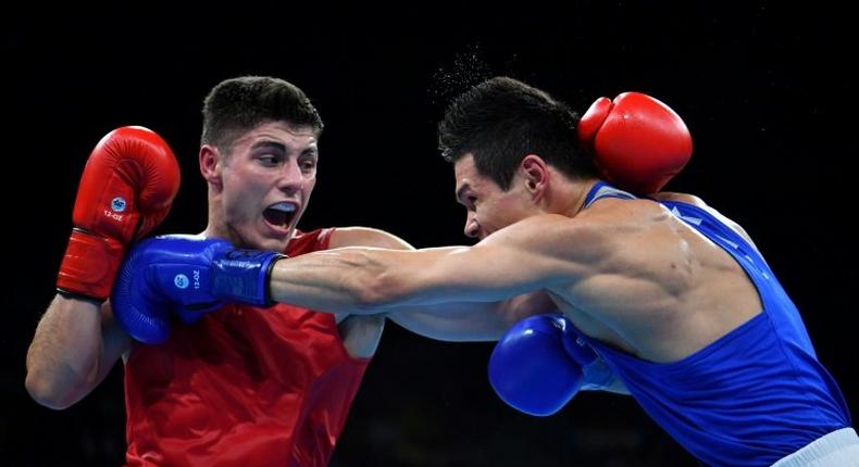 Great Britain's Josh Kelly (L) fights Kazakhstan's Daniyar Yeleussinov during the Men's Welter (69kg) match at the Rio 2016 Olympic Games August 11, 2016