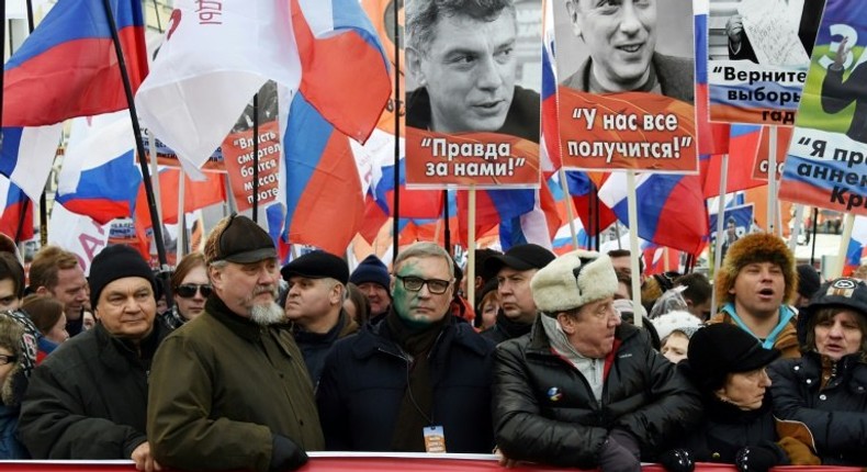 Russians march in Moscow in memory of slain opposition leader Boris Nemtsov