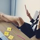 Hot business woman sitting in office with legs on table