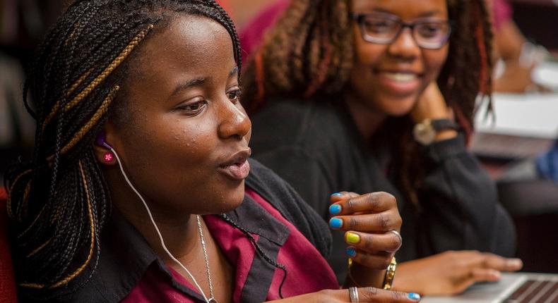 Female African student speaking in a classroom