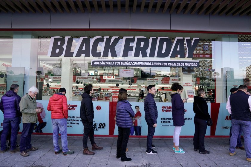 Shoppers queue during Black Friday sales in Barakaldo