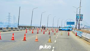 Lagos State Traffic Management Authority (LASTMA) officers place cones on the Third Mainland Bridge (Pulse)