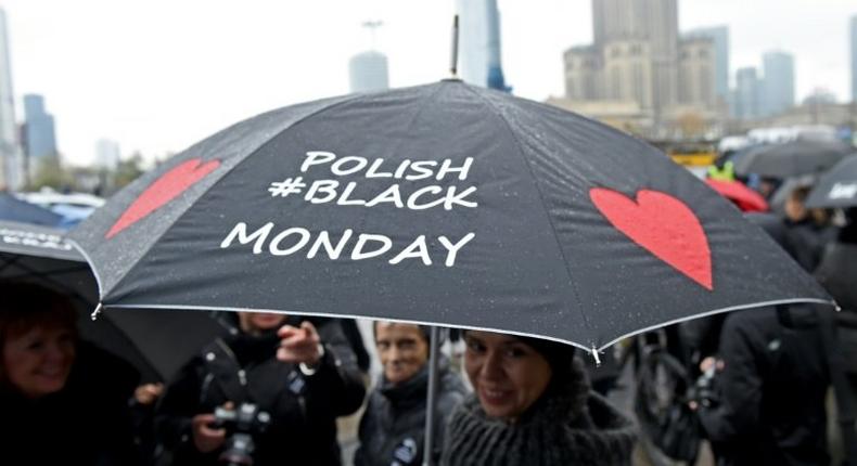 A woman raises her umbrella as a symbol of their protest, as thousands of women launched another round of protests against efforts to tighten Poland's abortion law on October 24, 2016