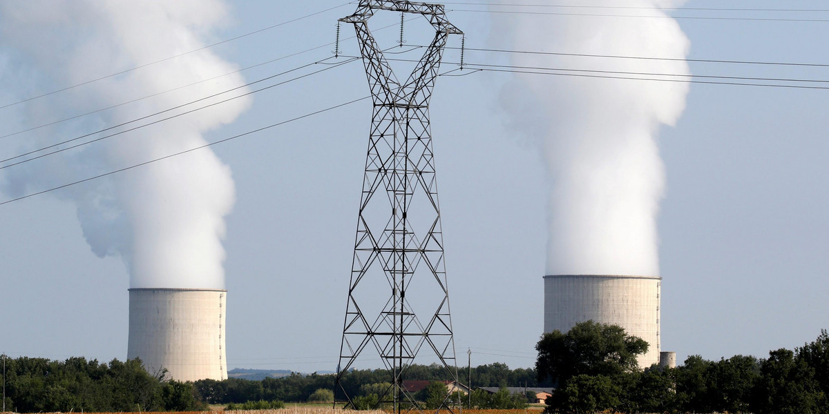 FILE PHOTO: Cooling towers and high-tension electrical power lines are seen near the Golfech nuclear plant on the border of the Garonne River between Agen and Toulouse, France