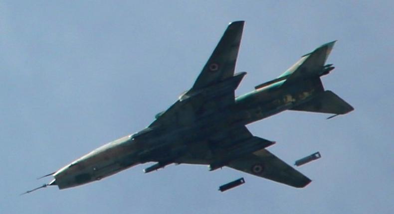 A Syrian Sukhoi SU-17 drops bombs over Jobar district on the eastern outskirts of Damascus on March 20, 2017