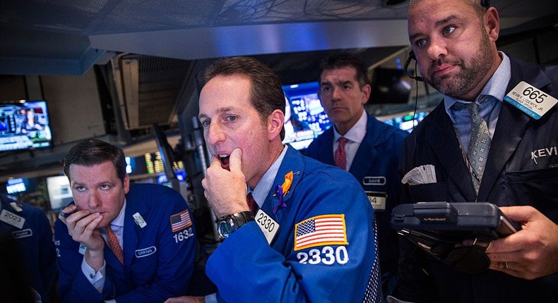 Traders work on the floor of the New York Stock Exchange