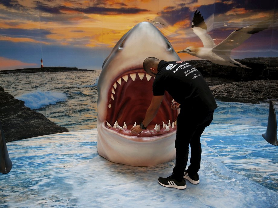 A man checks a shark display at the Dubai Mall, UAE.