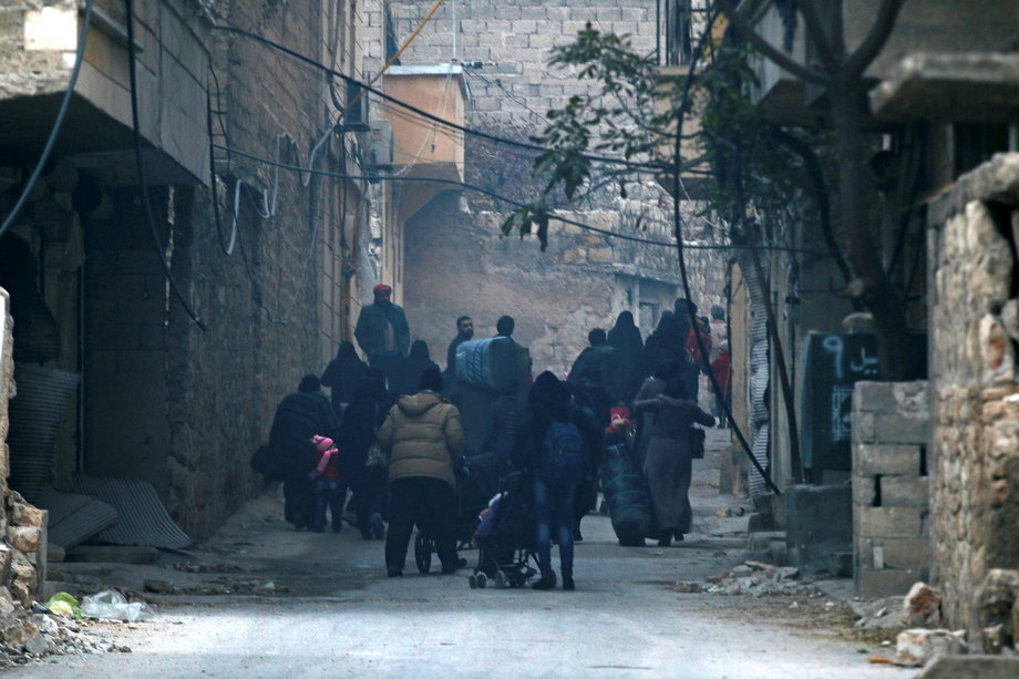 People fleeing deeper into the remaining rebel-held areas of Aleppo on Monday.